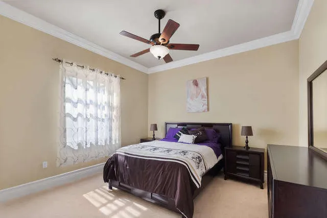 a bed room with furniture and a chandelier