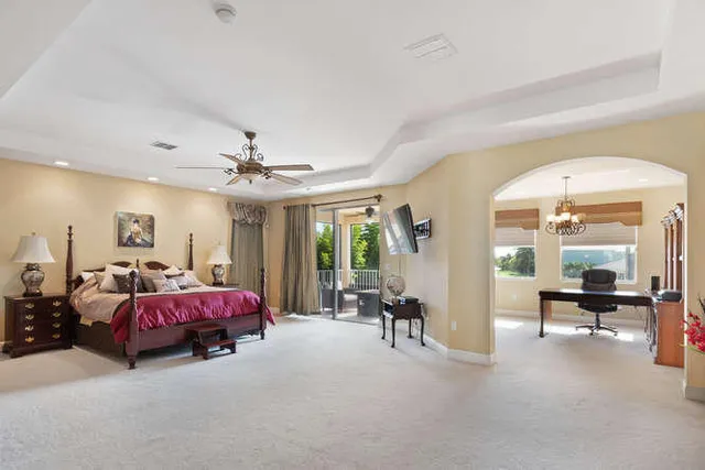 a living room with furniture a rug and a window