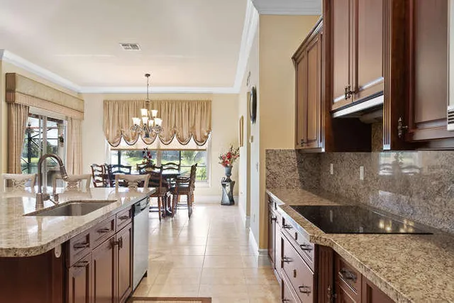 a large kitchen with a table and chairs