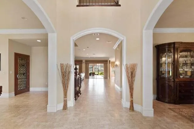 a very nice looking room with a large window and wooden floor