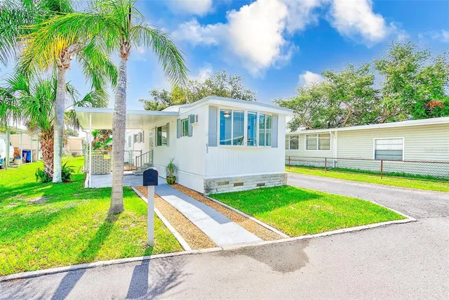 a view of pool with a yard