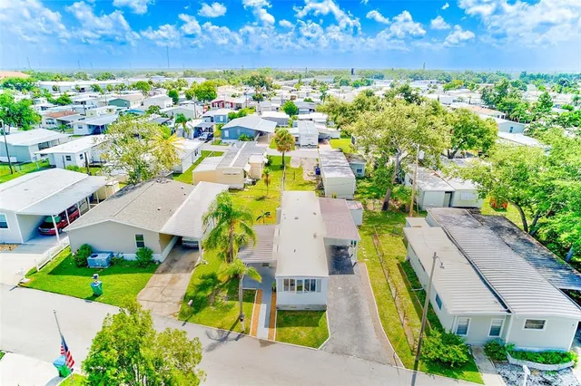 an aerial view of residential houses with swimming pool
