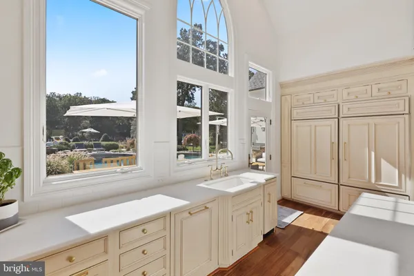 a view of a kitchen with a sink and windows