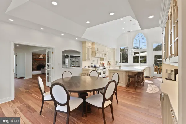a dining room with furniture and wooden floor