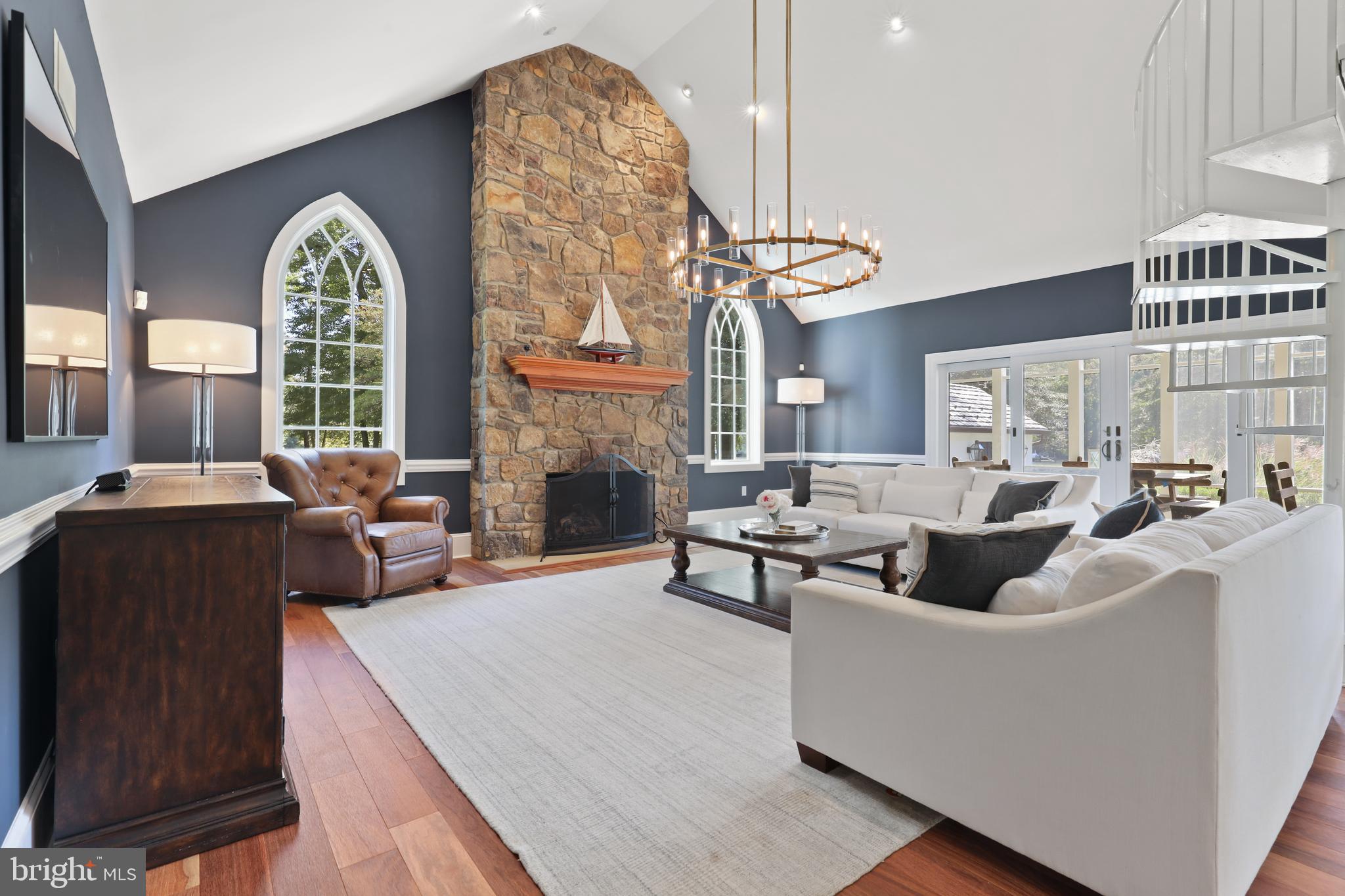 1524 Cedar Lane Farm Road Annapolis, MD 21409 - Photo 26 of 50 a living room with couches a fireplace with wooden floor