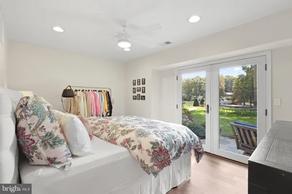 a bedroom with a large bed and a large window