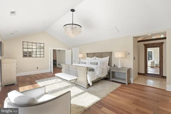 a spacious bedroom with a bed and window