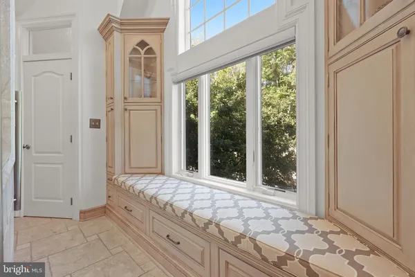 a bathroom with a granite countertop shower mirror and a bathtub