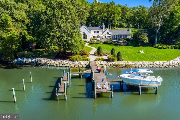 a view of a wooden deck and lake view