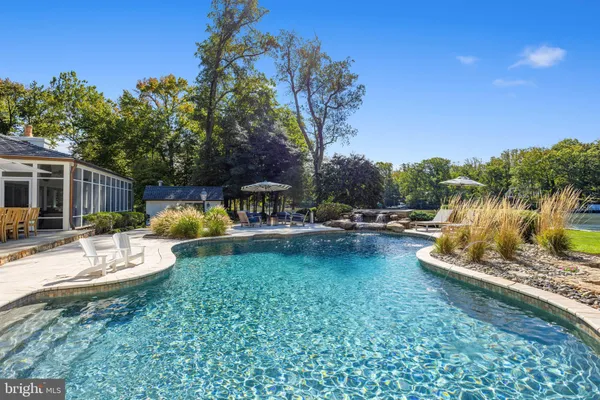 a view of a swimming pool with a patio