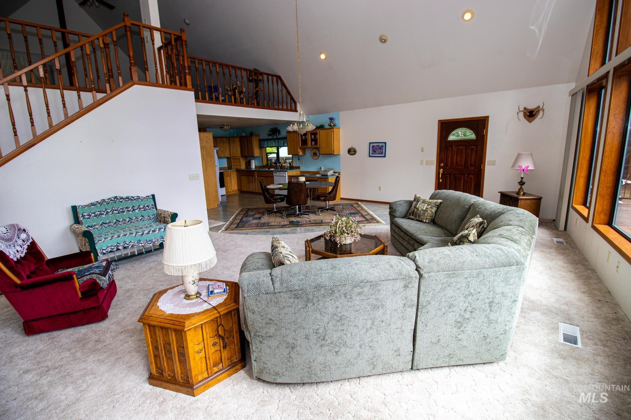 20888 Upper Fords Creek Road Weippe, ID 83553 - Photo 11 of 50 Carpeted living room featuring lofted ceiling and recessed lighting