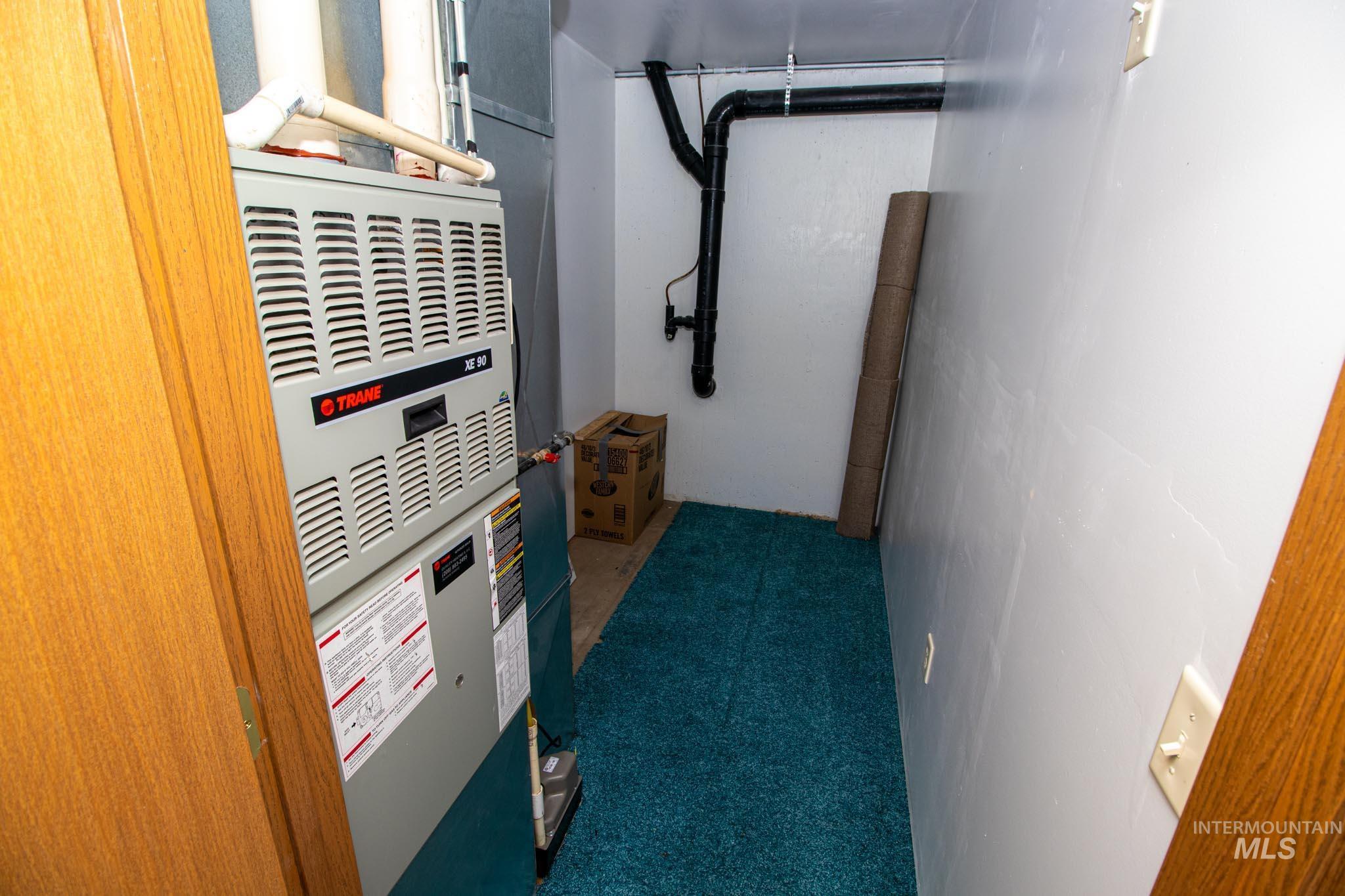 20888 Upper Fords Creek Road Weippe, ID 83553 - Photo 23 of 50 Utility room featuring heating unit