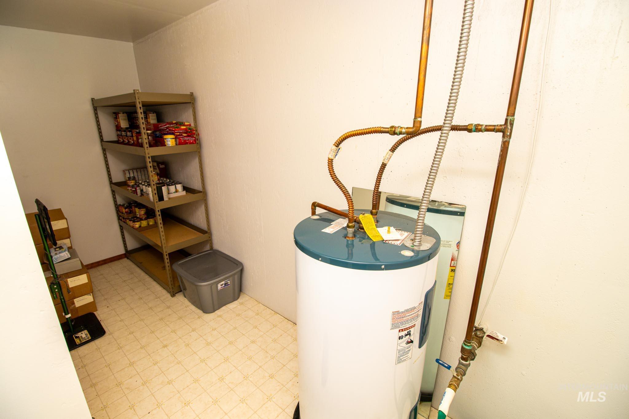20888 Upper Fords Creek Road Weippe, ID 83553 - Photo 24 of 50 Utility room with electric water heater