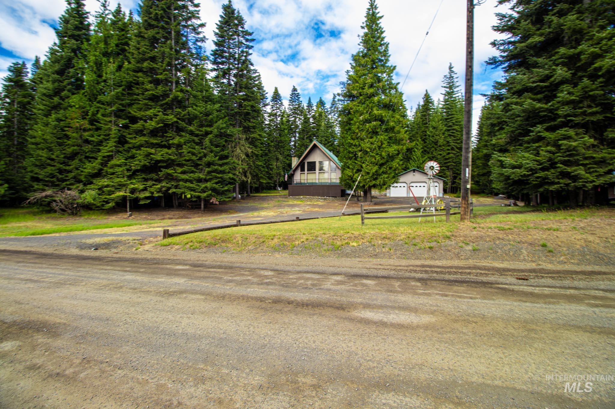 20888 Upper Fords Creek Road Weippe, ID 83553 - Photo 28 of 50 View of front of home featuring view of wooded area