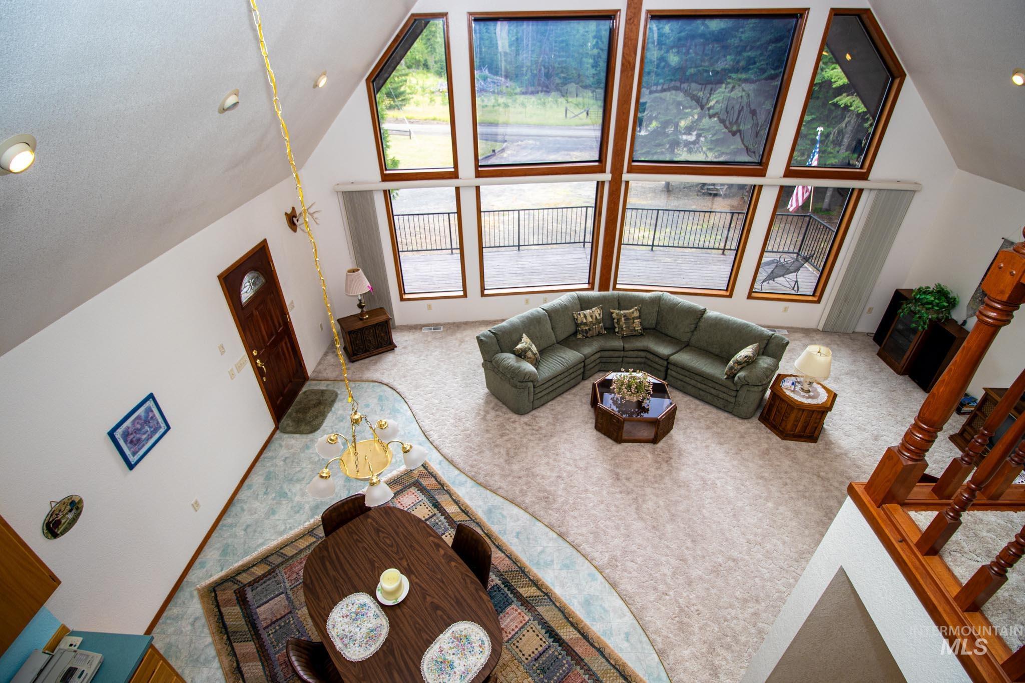 20888 Upper Fords Creek Road Weippe, ID 83553 - Photo 7 of 50 Living room with light colored carpet, lofted ceiling, and recessed lighting