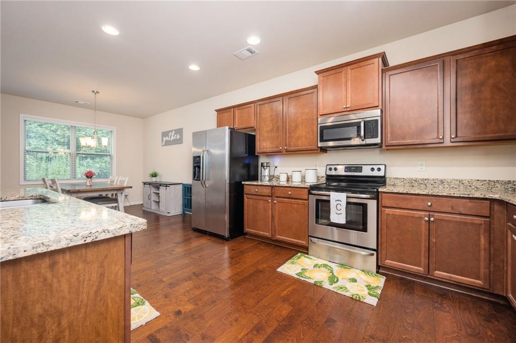 403 Franklin Lane Acworth, GA 30102 - Photo 13 of 26 a kitchen with stainless steel appliances granite countertop a refrigerator stove microwave and sink