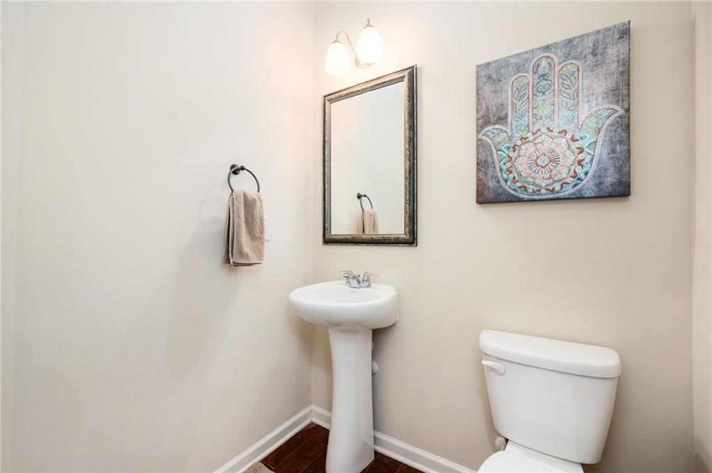 403 Franklin Lane Acworth, GA 30102 - Photo 15 of 26 a bathroom with a toilet sink and mirror