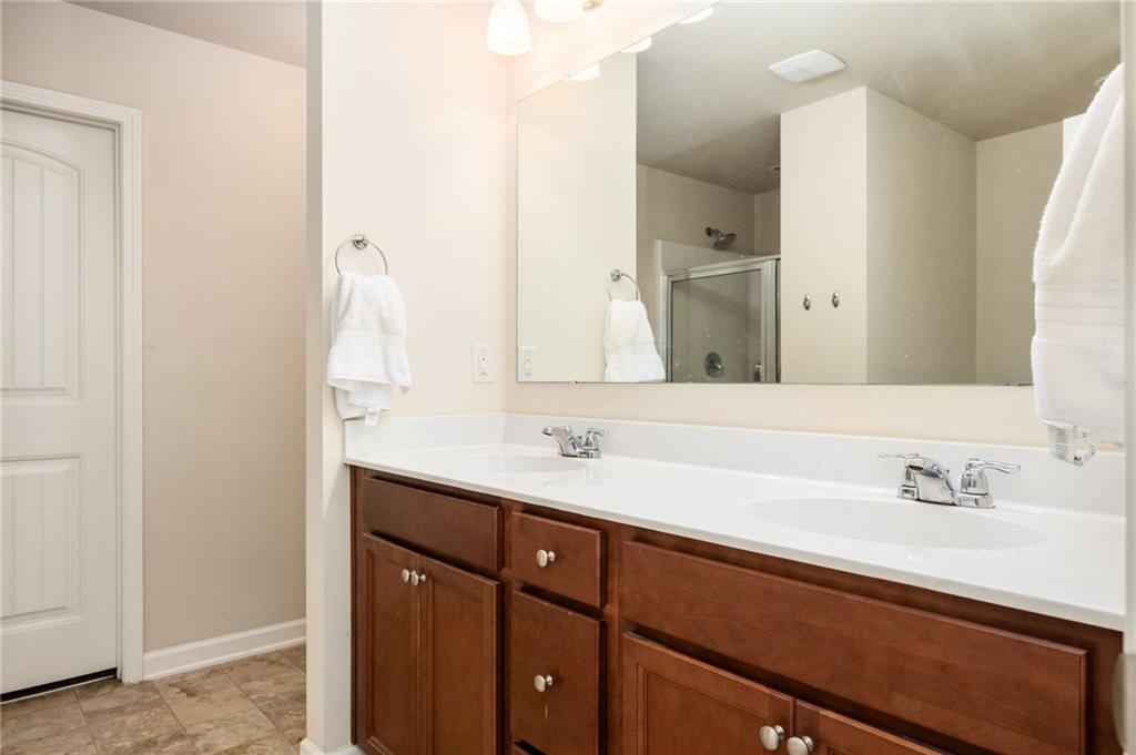 403 Franklin Lane Acworth, GA 30102 - Photo 18 of 26 a bathroom with a double vanity sink and a mirror
