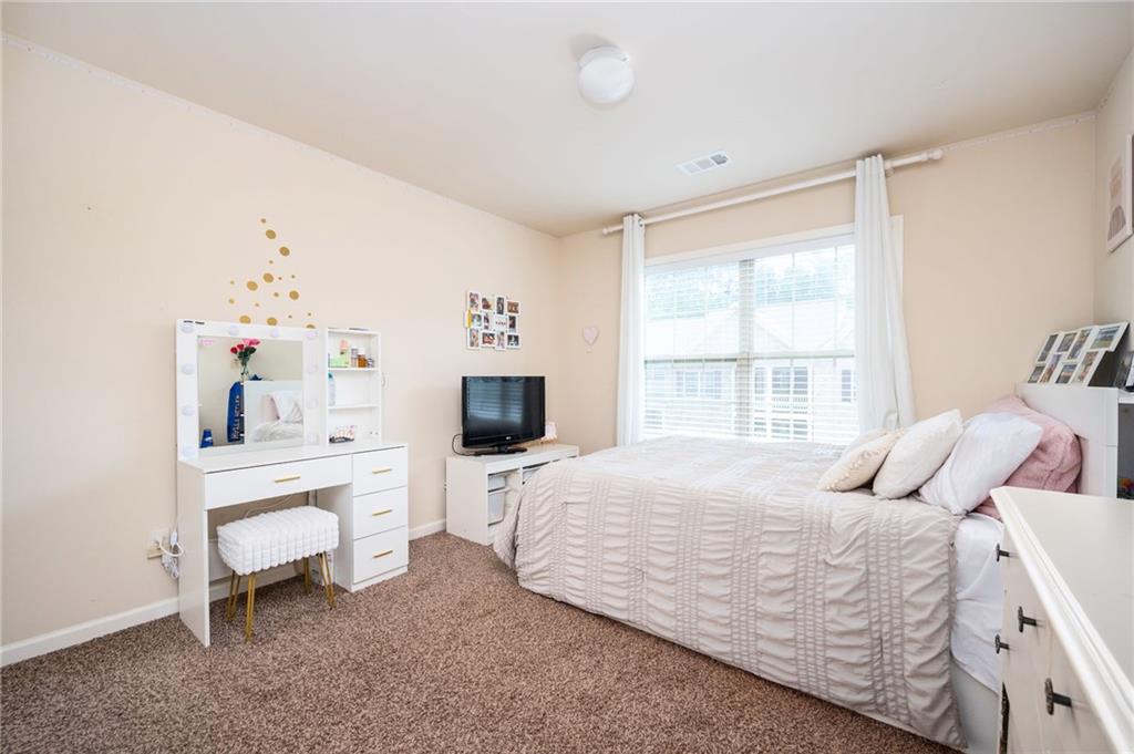 403 Franklin Lane Acworth, GA 30102 - Photo 20 of 26 a bedroom with a bed and a window