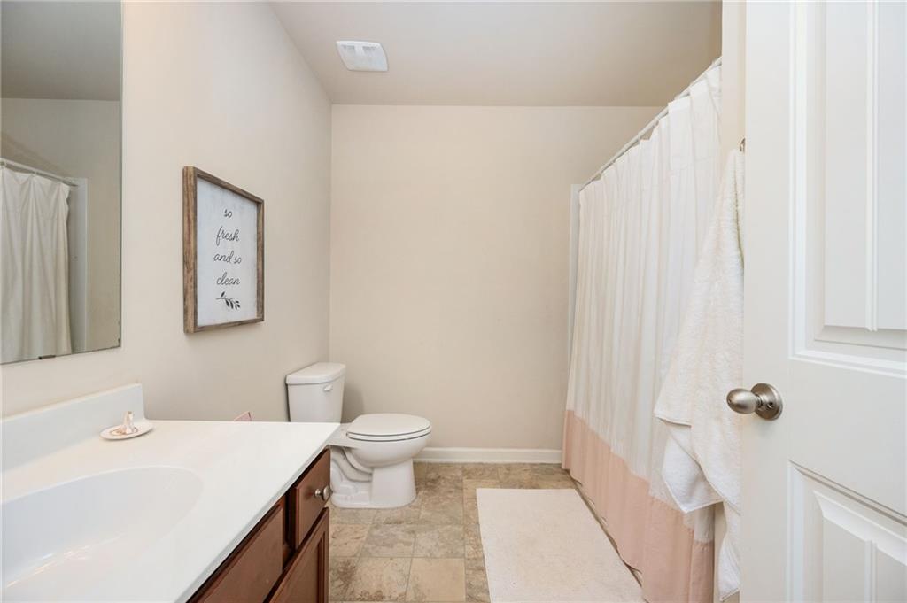 403 Franklin Lane Acworth, GA 30102 - Photo 21 of 26 a bathroom with a sink a toilet and shower