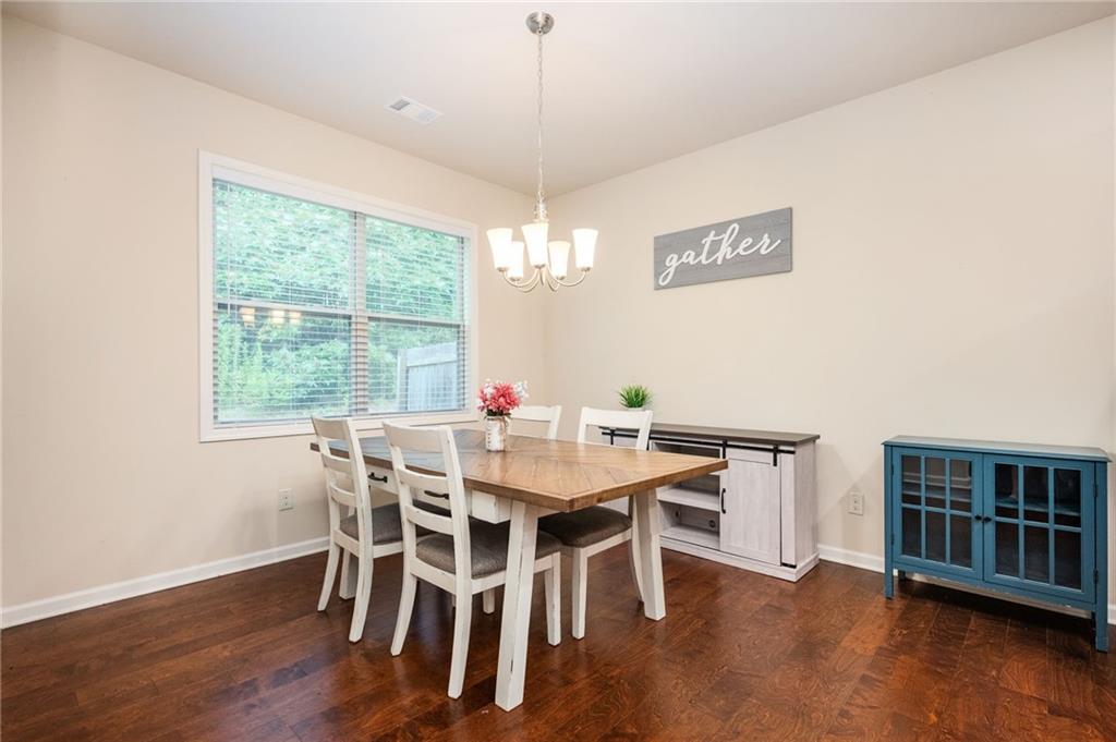 403 Franklin Lane Acworth, GA 30102 - Photo 4 of 26 a view of a dining room with furniture window and wooden floor