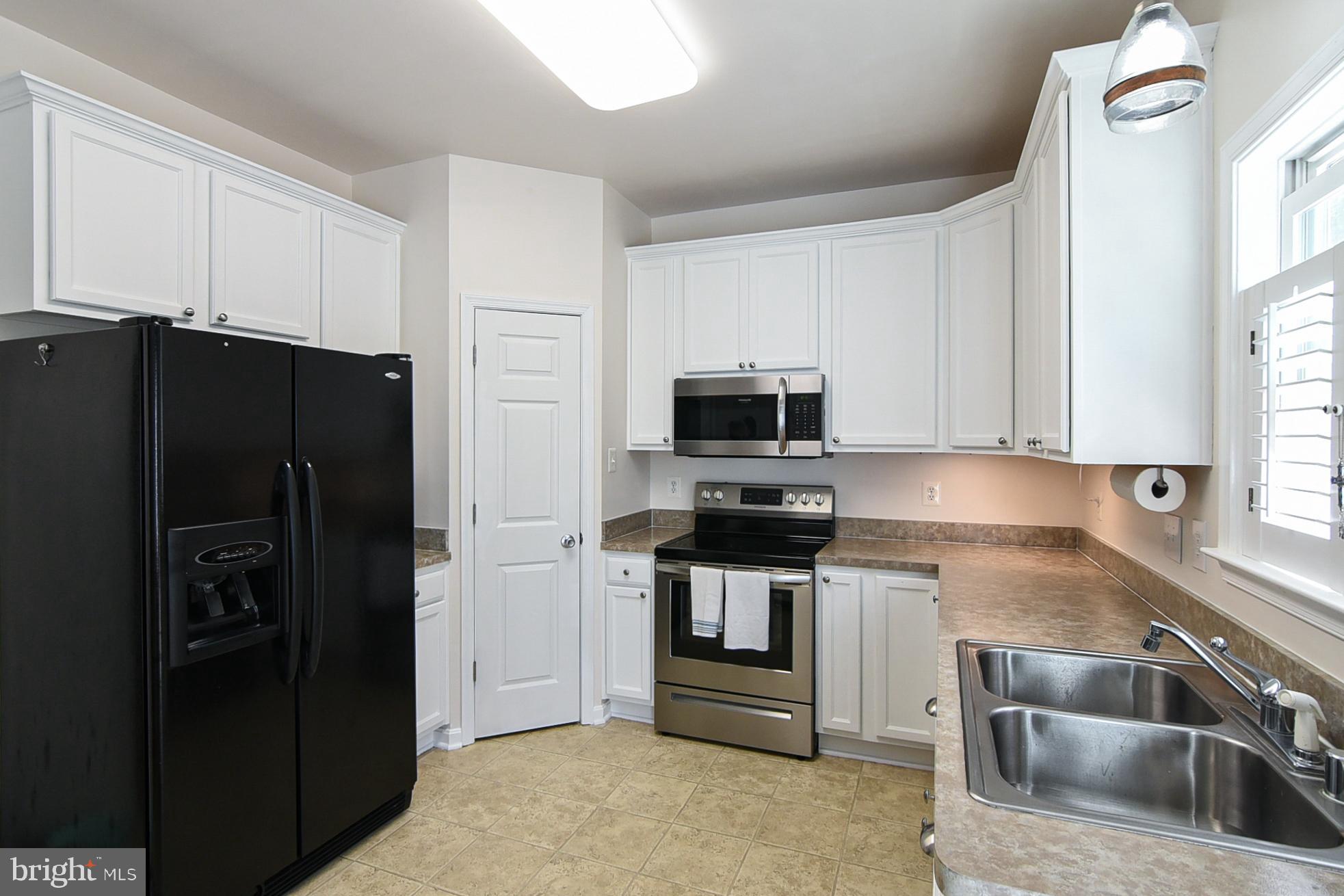 9174 Caledon Road King George, VA 22485 - Photo 11 of 34 Kitchen with Appliances & Double Sink