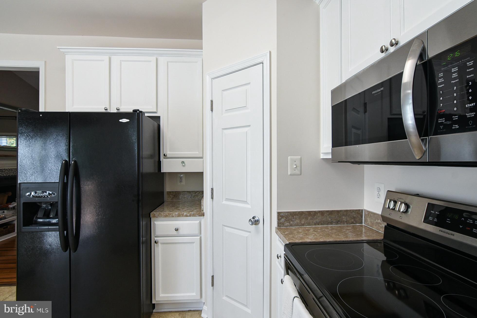 9174 Caledon Road King George, VA 22485 - Photo 12 of 34 Living Room/Kitchen View with Pantry