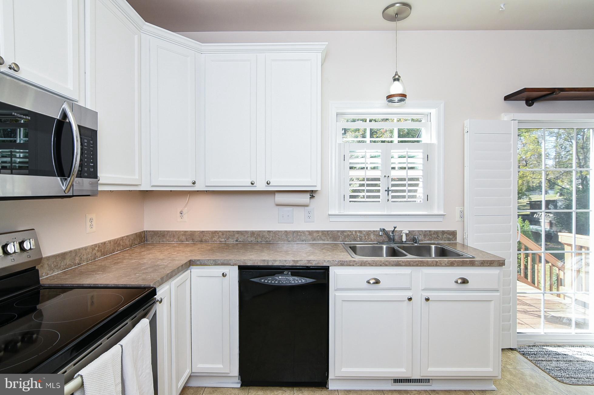 9174 Caledon Road King George, VA 22485 - Photo 15 of 34 Kitchen w/Dining Area & Walk Out to Back Deck