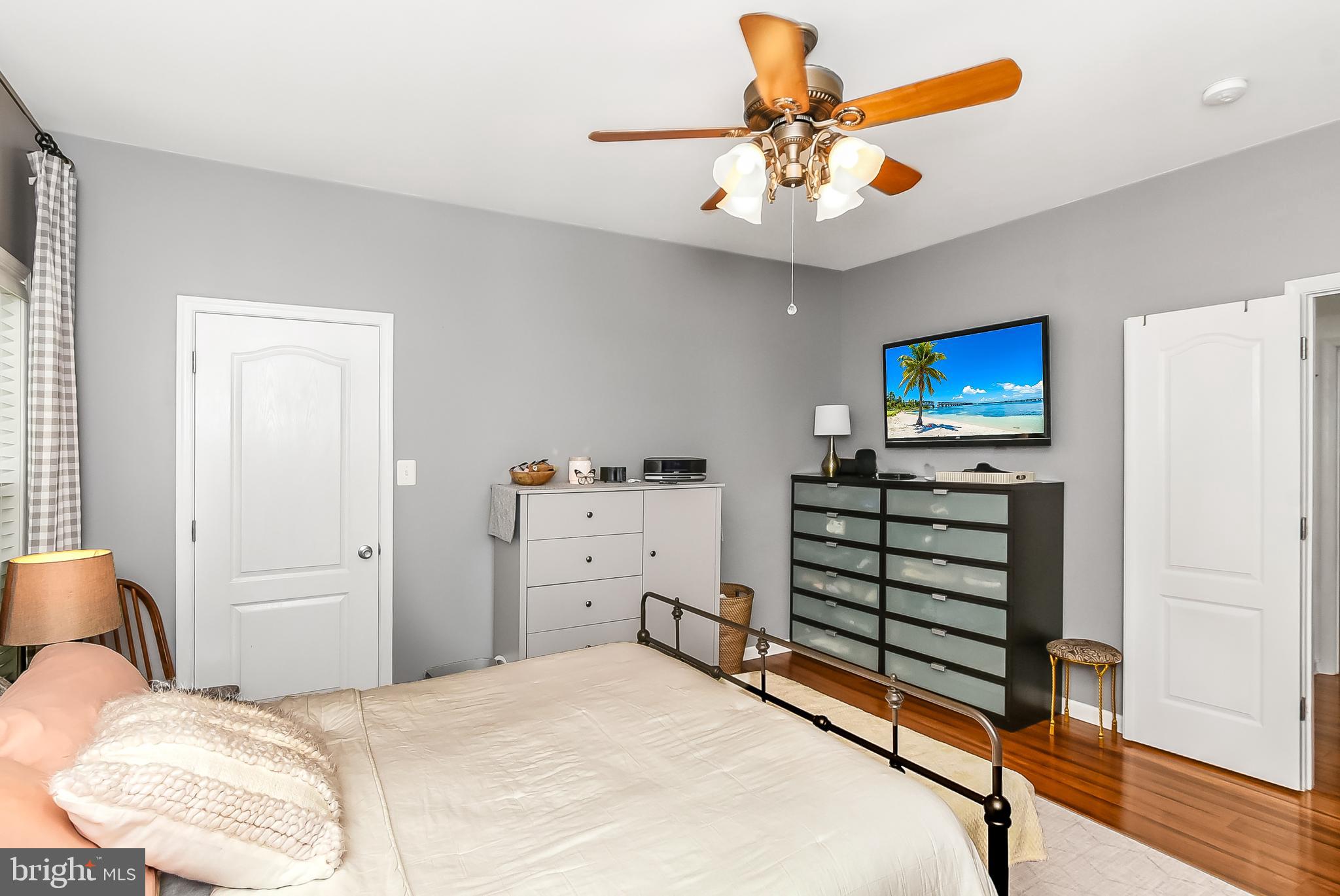 9174 Caledon Road King George, VA 22485 - Photo 17 of 34 Primary Bedroom with Hardwood Floors & Ceiling Fan