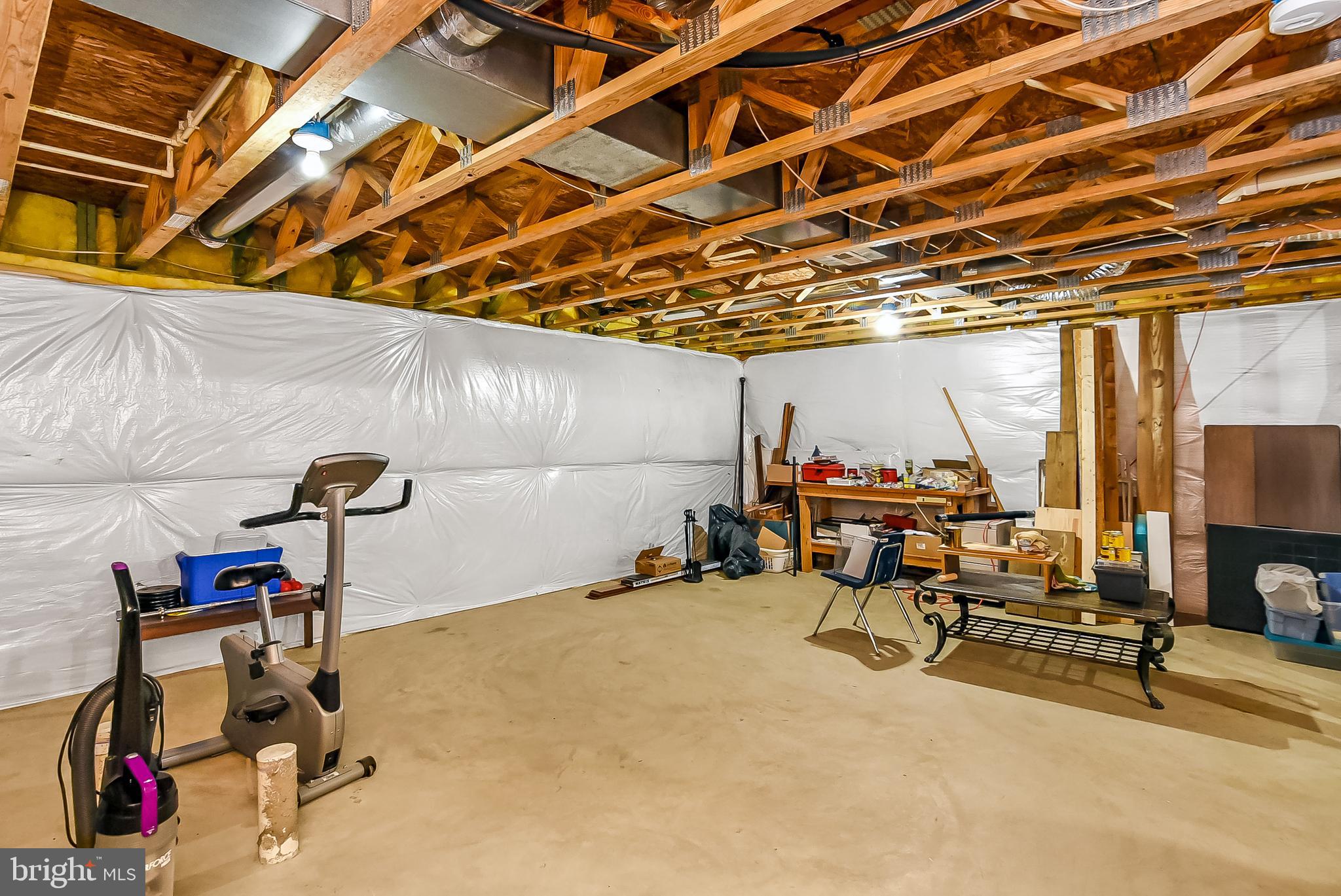 9174 Caledon Road King George, VA 22485 - Photo 29 of 34 Unfinished Basement with Plenty of Storage Room