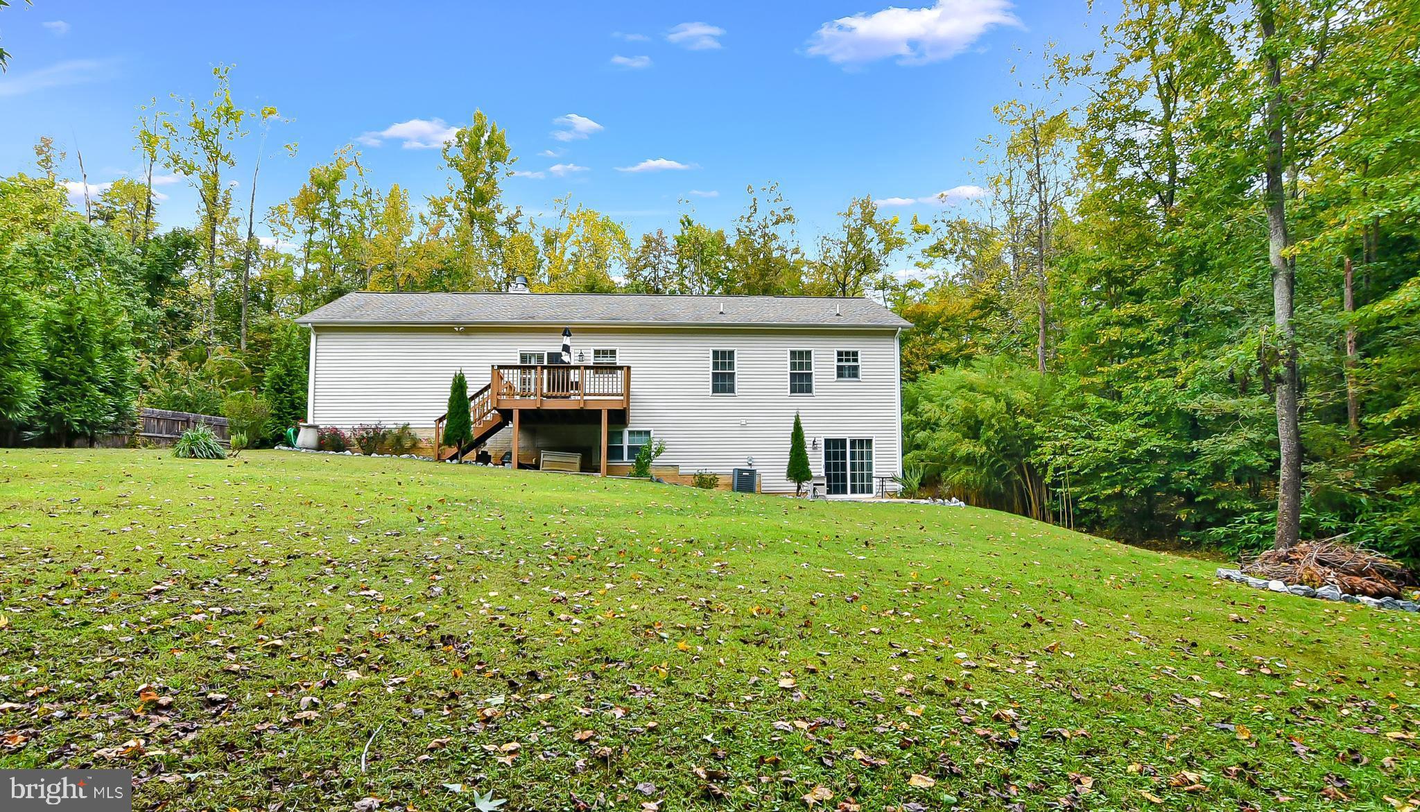 9174 Caledon Road King George, VA 22485 - Photo 33 of 34 Rear Exterior w/Spacious Back Deck & Back Yard