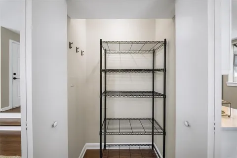 a room with a walk in closet and bathroom