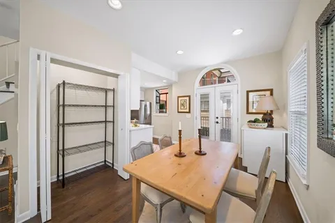 a view of a dining room with furniture and a window