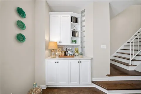 a view of kitchen with furniture and wooden floor