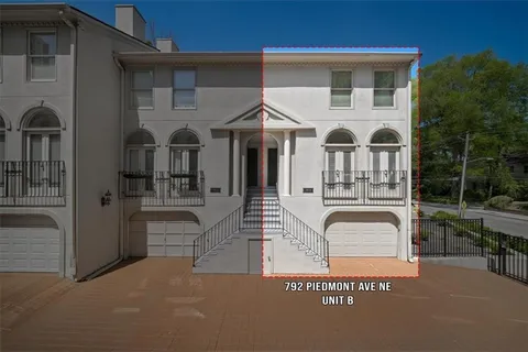 a front view of a house with large windows