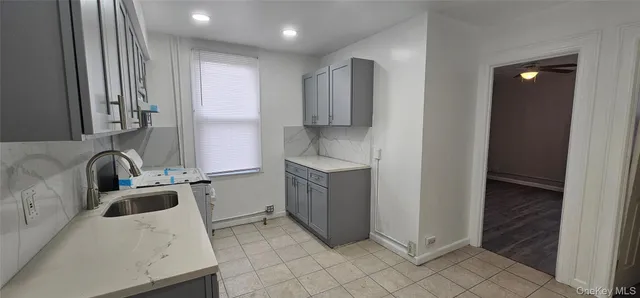 a kitchen with a sink a stove and refrigerator