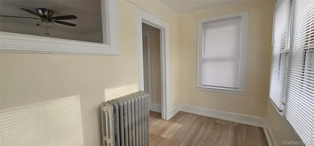 a view of a hallway with a window