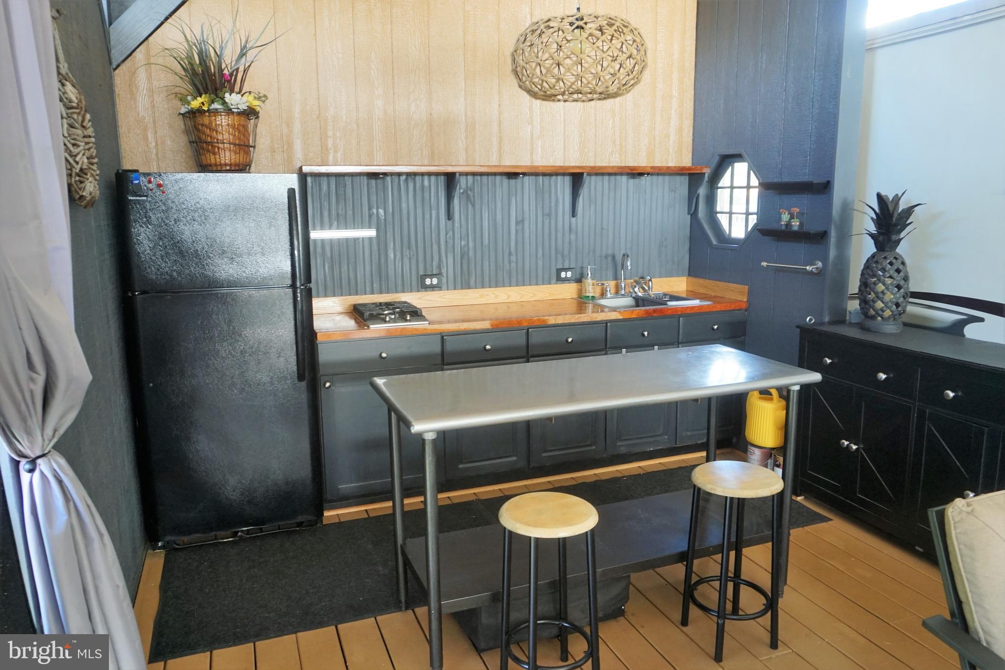 69 Block Falling Waters, WV 25419 - Photo 11 of 34 a kitchen with a table chairs and a stove top oven