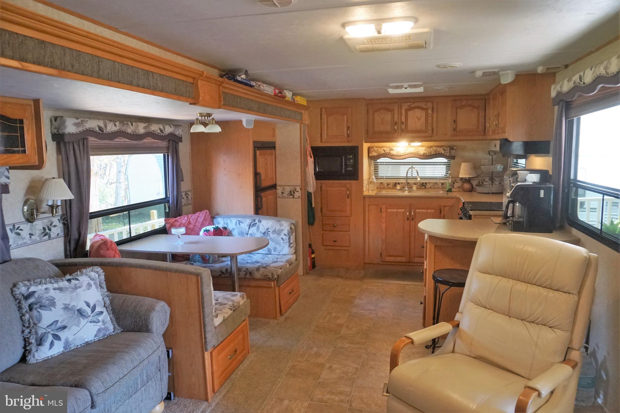 69 Block Falling Waters, WV 25419 - Photo 13 of 31 a dining room with furniture and a kitchen view