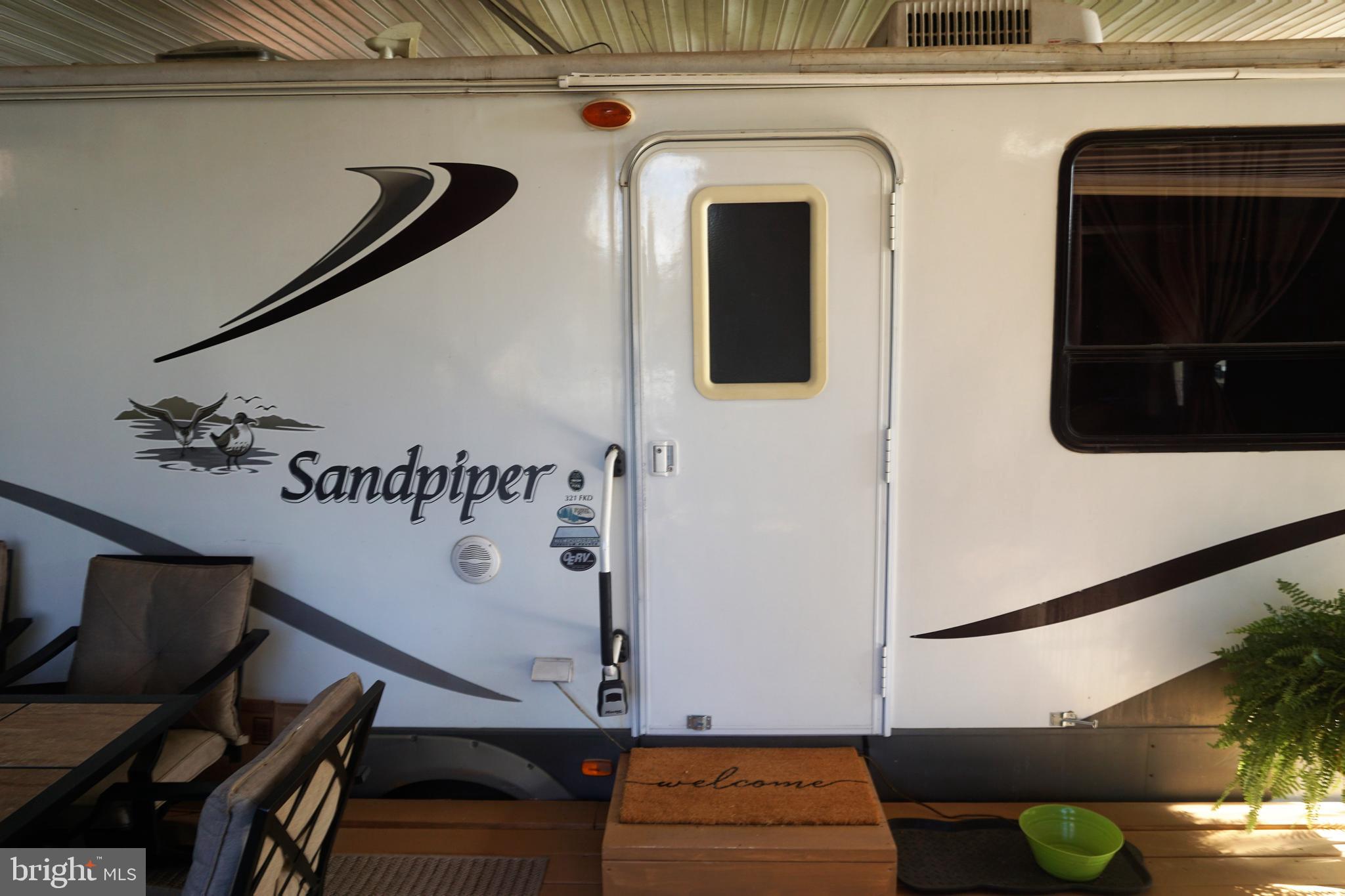 69 Block Falling Waters, WV 25419 - Photo 14 of 34 a view of a hallway with wooden floor and furniture