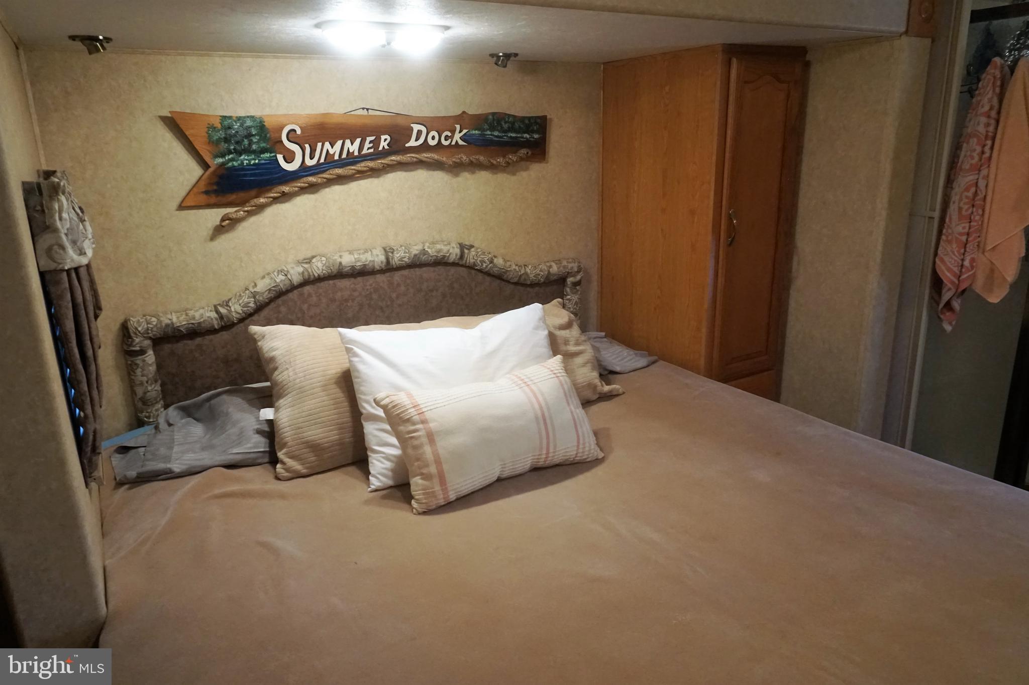 69 Block Falling Waters, WV 25419 - Photo 17 of 31 a bedroom with a bed and a night stand