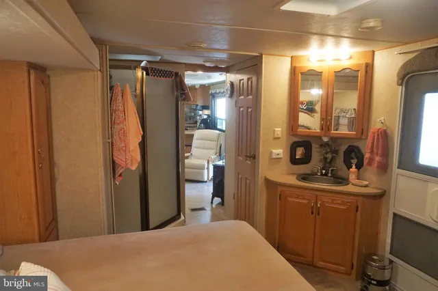 a bedroom with a bed and a mirror