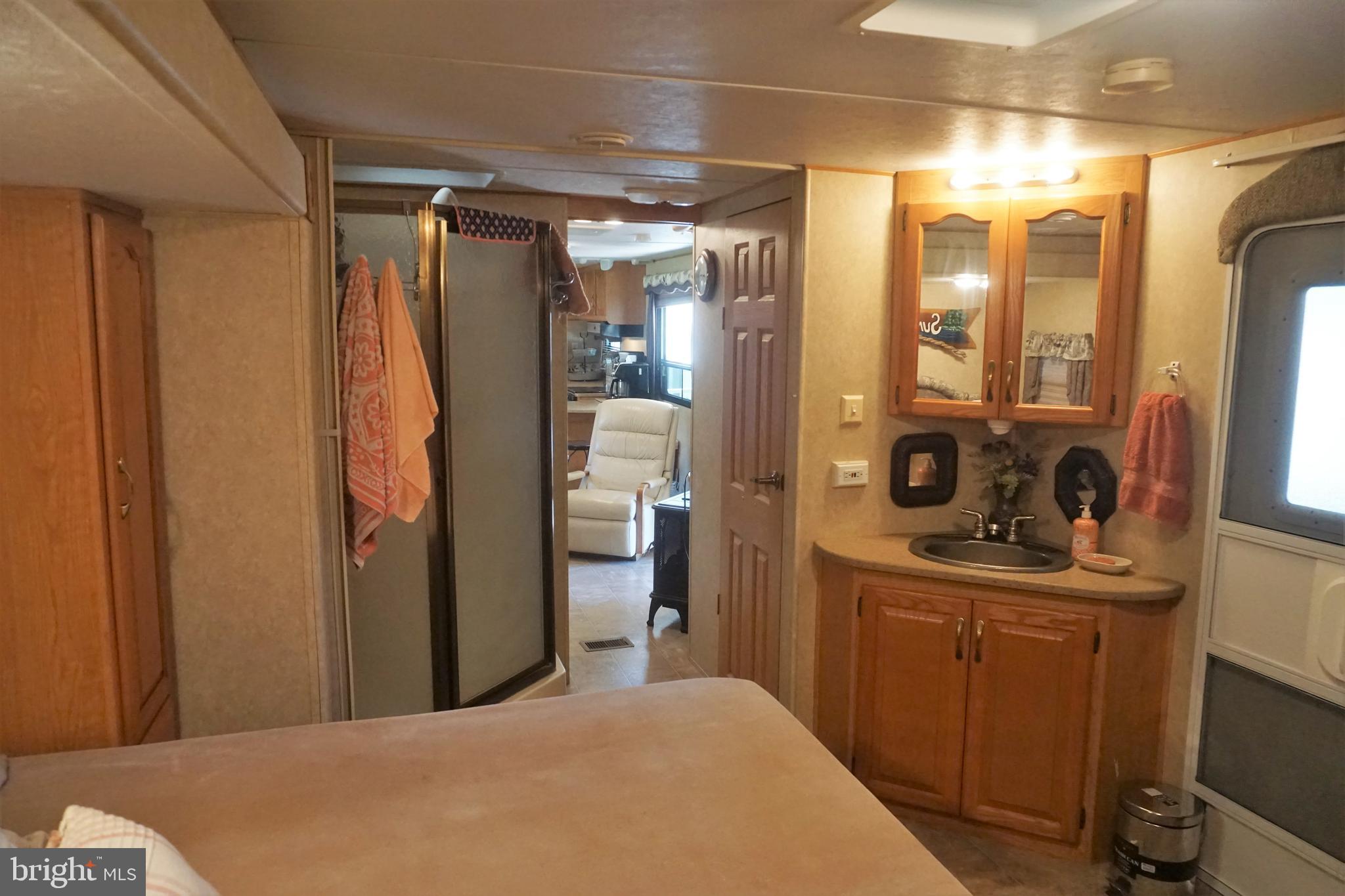 69 Block Falling Waters, WV 25419 - Photo 19 of 31 a bedroom with a bed and a mirror
