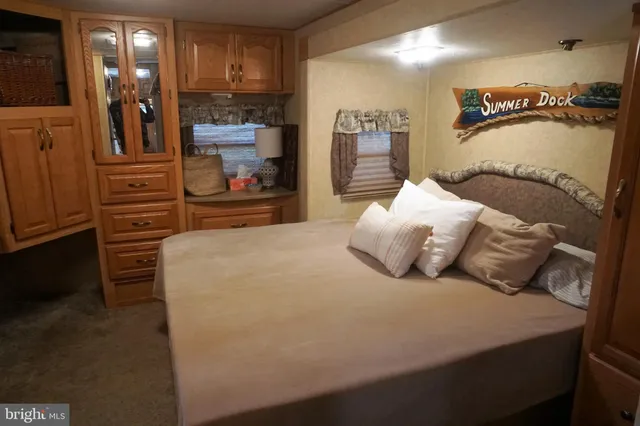 a bedroom with a bed and walk in closet