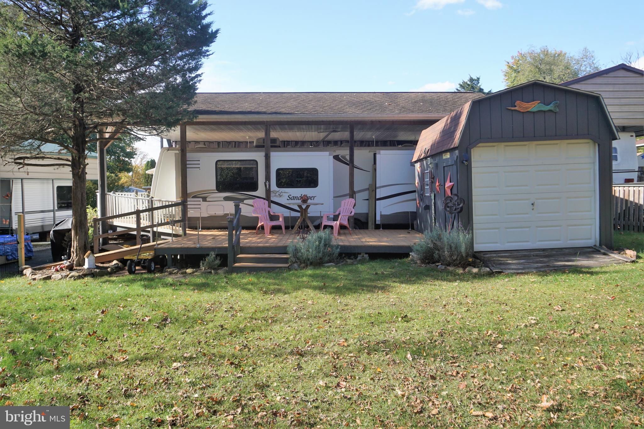 69 Block Falling Waters, WV 25419 - Photo 29 of 31 a backyard of a house with yard and garage