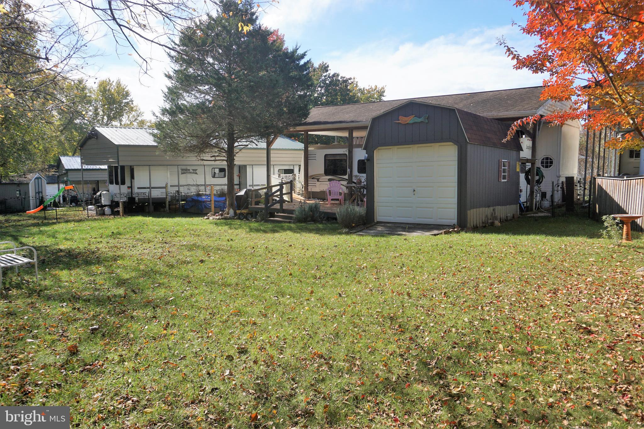 69 Block Falling Waters, WV 25419 - Photo 30 of 31 a view of a house with a yard