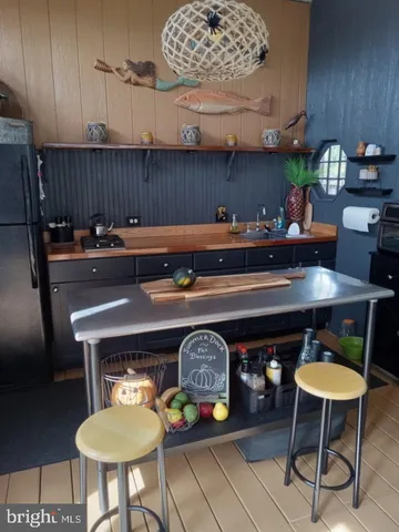 a kitchen with a table and chairs in it