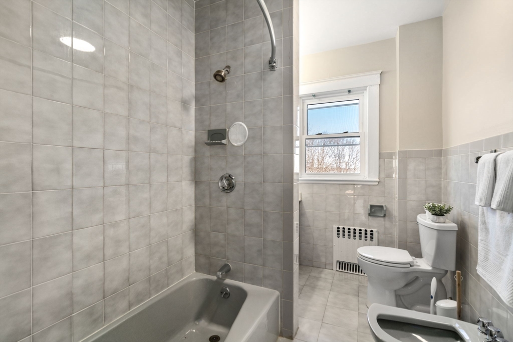8 Charlesview Street, Unit 8 Boston, MA 02135 - Photo 11 of 12 a bathroom with a toilet and a shower