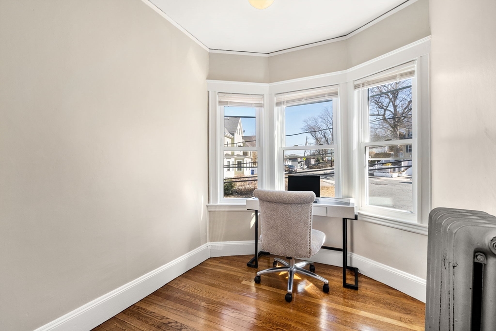 8 Charlesview Street, Unit 8 Boston, MA 02135 - Photo 10 of 12 a view of a workspace with furniture and a window