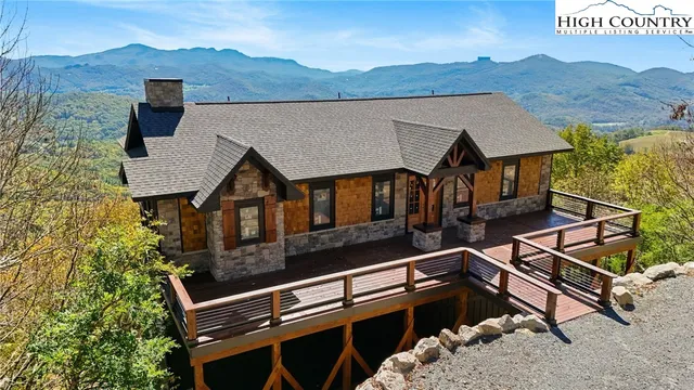 an aerial view of houses with a street
